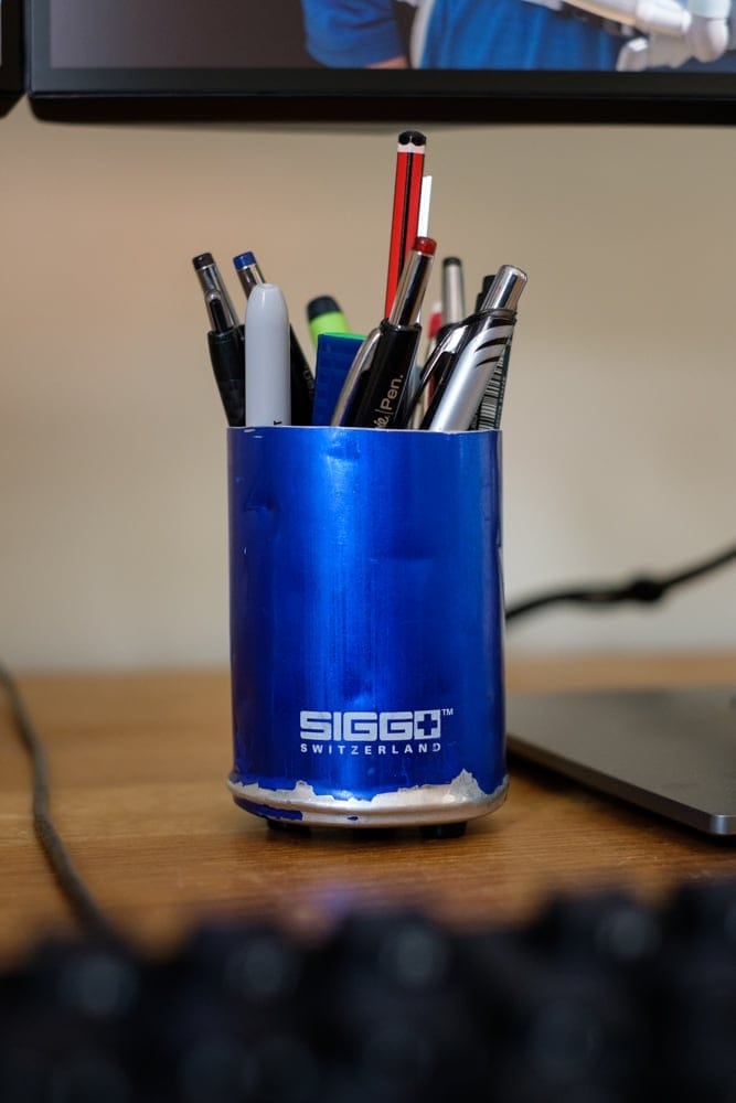 A re-purposed water bottle makes a good pen pot